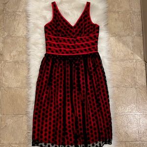 Aysemmetrical red and black polka dot dress